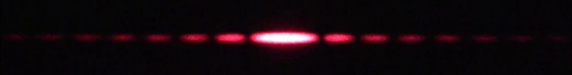 Diffraction pattern from a variable-width single slit, blocking much of the laser beam